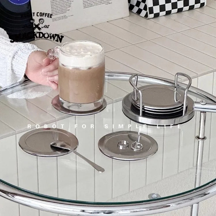 stainless steel coaster set on a table