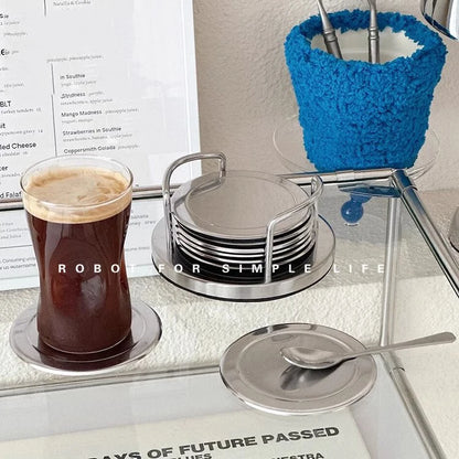 stainless steel coaster set on a table with coffee